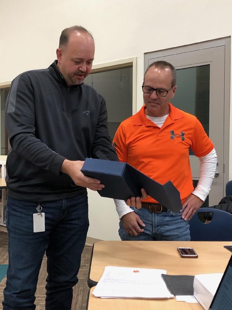 Kraig Hissong presenting Chris Moell with his award for his service and dedication to the WL-S Board of Education